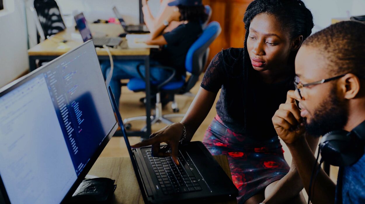 Two people sitting at a computer together