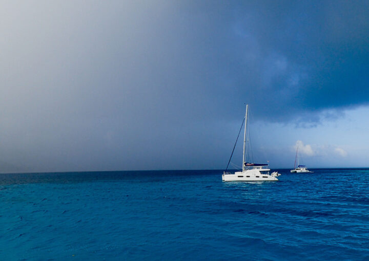 Image of the sky and a sail boat on the ocean